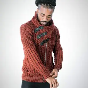 Man wearing a stylish rust-colored knitted sweater with toggle buttons.