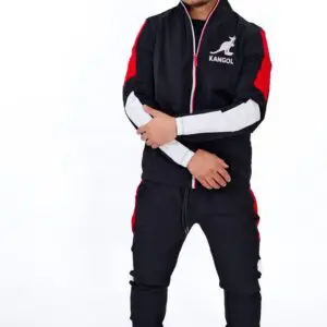 Man wearing a black and red athletic tracksuit with white accents.