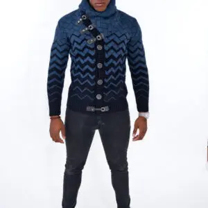 Man wearing a blue patterned jacket and dark jeans.