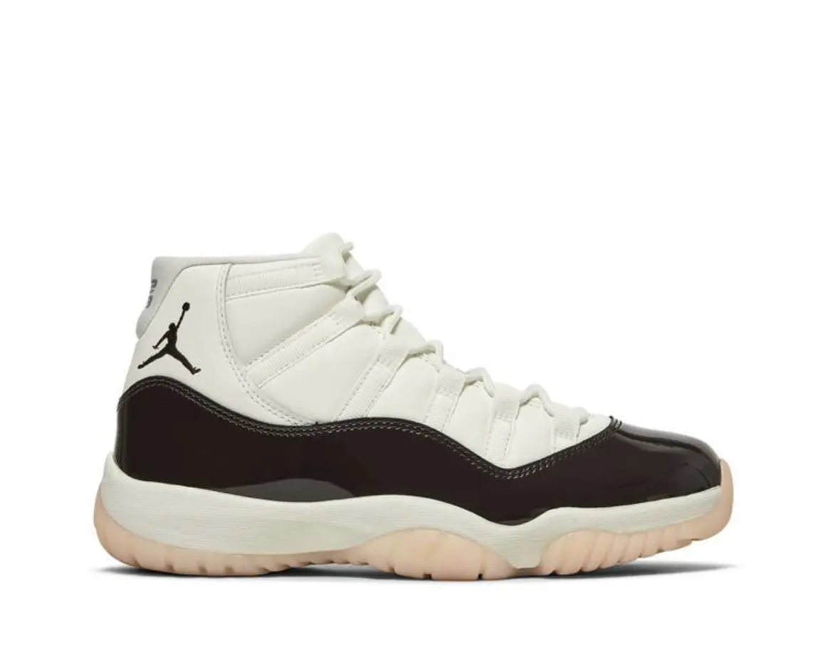 White and black high-top sneaker with a gum sole.