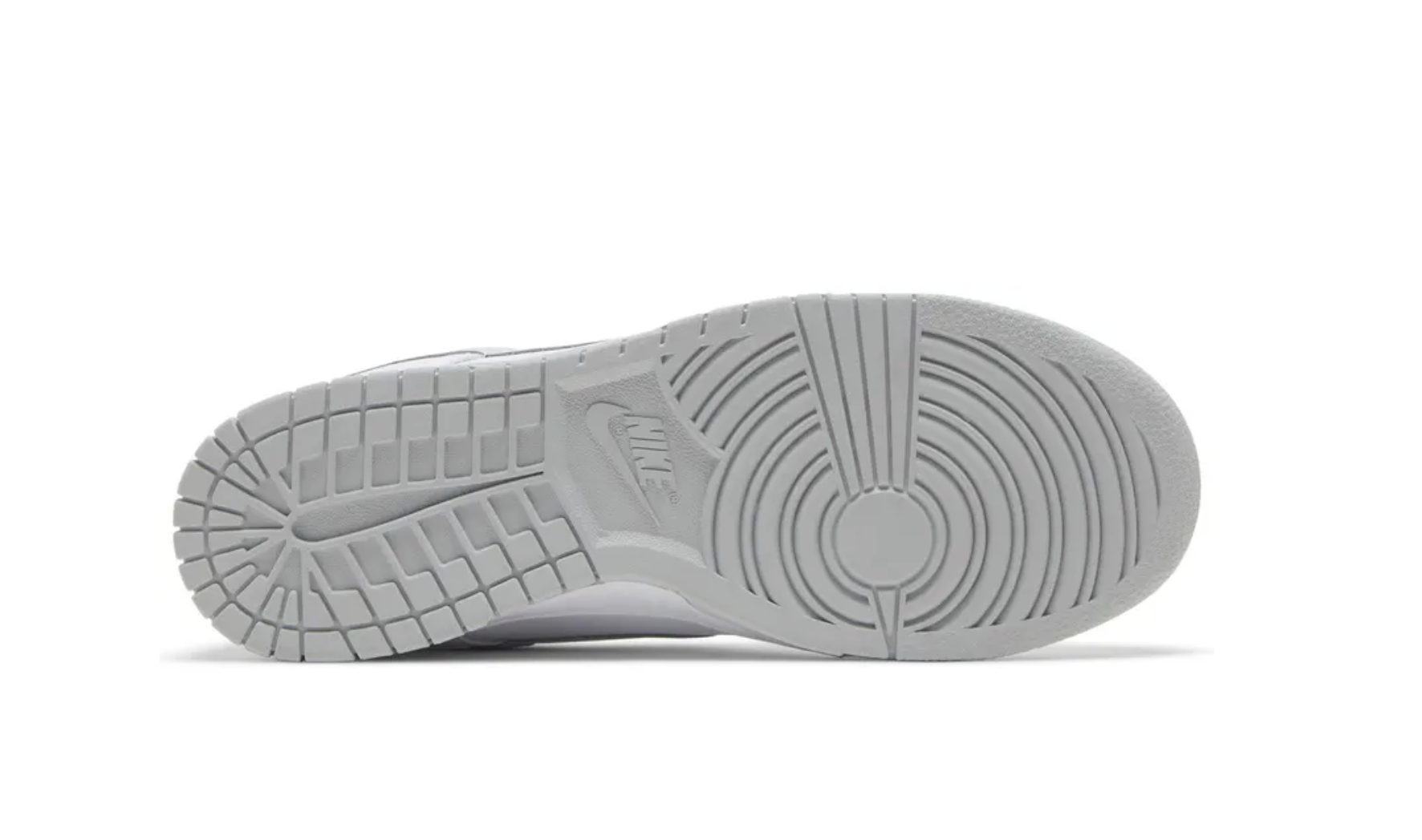 Bottom view of a grey sneaker sole with detailed tread patterns.