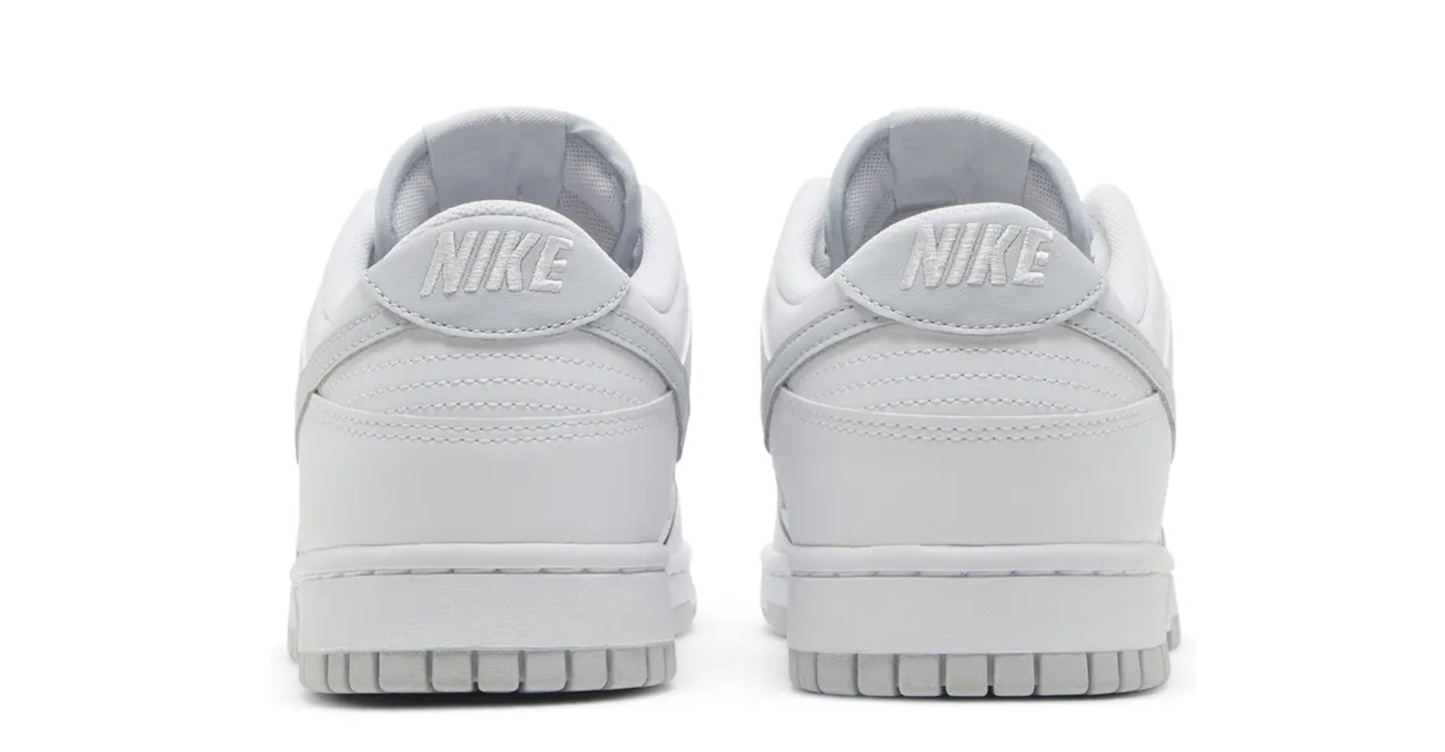 Pair of white Nike sneakers shown from the back.