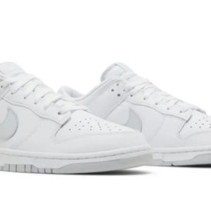 A pair of clean white Nike sneakers with a minimalist design.