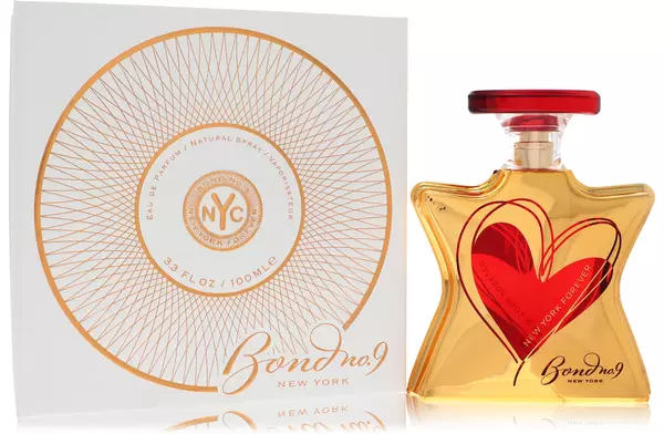 A heart-shaped bottle of perfume with elegant packaging.